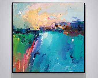 Puede incluir: Pintura abstracta de paisaje con marco negro. La obra presenta una vibrante mezcla de colores, incluyendo azules, verdes, amarillos y rosas, creando una escena impresionista texturizada. Las pinceladas son visibles, agregando profundidad y movimiento a la pieza.