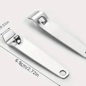 May include: Two stainless steel bottle openers. Each opener is 6.9 inches long and 0.51 inches wide, with a hole at the end for hanging. The openers are on a white background.