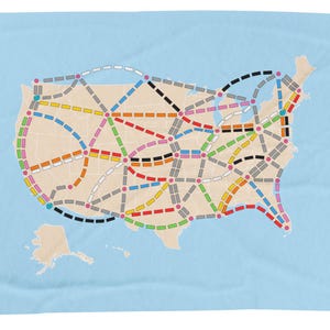 May include: A map of the United States with a network of colored lines connecting cities. The lines represent different routes for a board game.