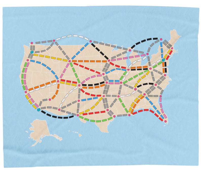 May include: A map of the United States with a network of colored lines connecting cities. The lines represent different routes for a board game.