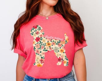 Peut inclure: Un t-shirt rose avec une silhouette de chien doodle florale et le texte "doodle mama" en blanc.