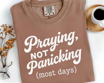 Praying Not Panicking PNG, Funny Bible Verse Shirt Design, Faith-Based Christian Quote PNG, Retro Jesus Shirt PNG for Christian Mama