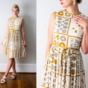 vintage 1960&#39;s gold floral print dress. 60 ivory and yellow dress. pleated skirt. sleeveless. flowers. bow. xs.