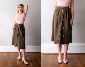 1950's Balmain wool skirt. vintage 50s green skirt. yellow buttons. olive green. pockets. xs