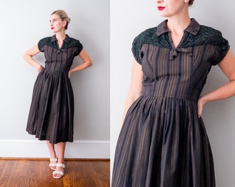 1950's black & brown dress. small 50 striped dress. collar. black emboirdered lace. cap sleeves. full skirt.