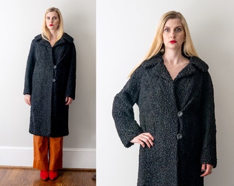 50's black Persian Lamb fur coat. 1950 medium coat. cocoon. asymmetrical. buttons. collar. pockets.