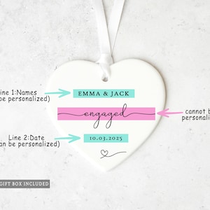 May include: White heart-shaped ornament with a ribbon for hanging. The ornament features the names "EMMA & JACK" above the word "engaged" and the date "10.03.2025". A small heart is at the bottom.