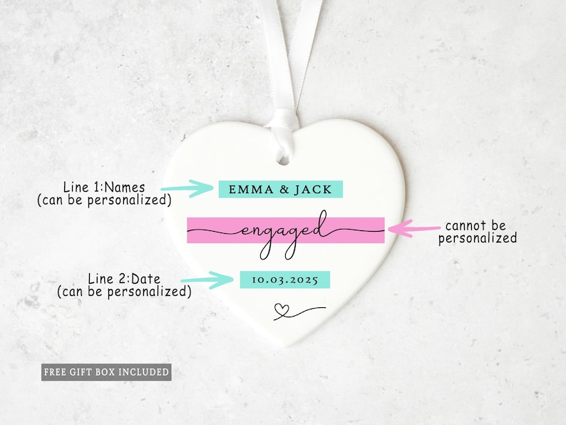 May include: White heart-shaped ornament with a ribbon for hanging. The ornament features the names "EMMA & JACK" above the word "engaged" and the date "10.03.2025". A small heart is at the bottom.