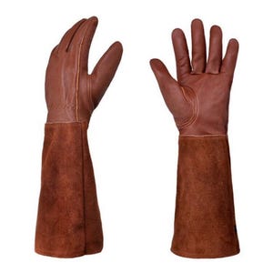 May include: Two brown leather work gloves with long suede cuffs. The gloves are made of a smooth leather material and are designed to protect the hands and forearms. The gloves are shown against a white background.