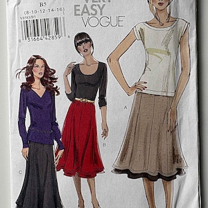 May include: A Very Easy Vogue sewing pattern, V8583, featuring illustrations of three different skirt and top combinations. The pattern includes sizes 8-16. The cover art showcases a woman in a white top and a brown skirt.