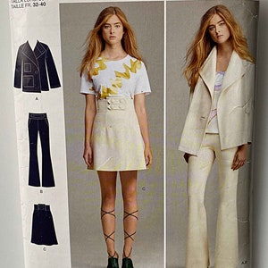 May include: A sewing pattern for a women's outfit by Cynthia Rowley. The pattern includes a jacket, pants, and a skirt. The pattern number is 8058 and the size is D5. The pattern is designed and printed in the USA.