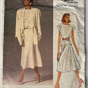 May include: Vogue Patterns American Designer sewing pattern for a white dress and jacket by John Anthony. The pattern number is 1387.