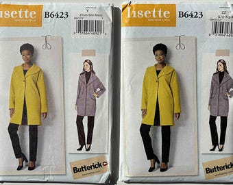 May include: Two sewing pattern packets for Lisette B6423 coats. The packets feature illustrations of the coats in yellow and gray. The packets also include the size range, the brand name, and the pattern number.
