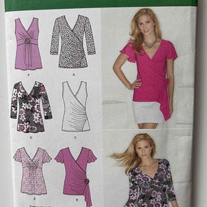 May include: Simplicity pattern 1916H5 featuring wrap tops. The pattern includes various styles with V-necklines, some with sleeves and decorative details. The image shows illustrations of the finished garments and a model wearing a pink wrap top.