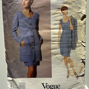 May include: Vintage Vogue pattern featuring designs by Oscar de la Renta. The pattern includes a long-sleeved coat dress with large buttons and a matching skirt, and a sleeveless dress with a jacket. The pattern is labeled "Vogue American Designer."