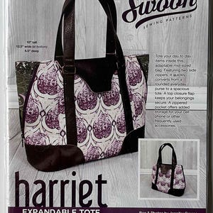 May include: A sewing pattern for an expandable tote bag, named "Harriet." The bag is 10 inches tall, 12.5 inches wide at the bottom, and 4.5 inches deep. The design features a purple and white patterned fabric with brown accents and handles. The bag has two side zippers and a top closure flap.