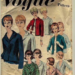 May include: Vintage Vogue pattern envelope featuring illustrations of women in various jacket designs. The cover displays the text "BASIC JACKET DESIGN" and "Vogue Pattern". The illustrations showcase jackets in colors like red, blue, green, and pink.