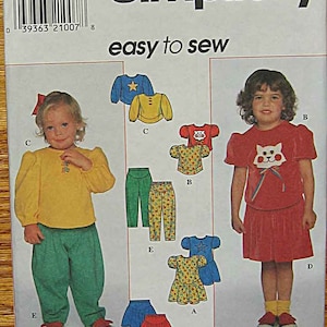 Toddler's, Girls, Children's, Easy To Sew Knit Dress, Top, Skirt, Pants, Cat, Star Appliqués Simplicity 7886 Sewing Pattern UNCUT Size 2-3-4 image 1