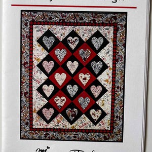 May include: A quilt pattern titled "Yours Truly" by Swirly Girls Design. The quilt features heart-shaped blocks in red, black, and white, with various patterns. Finished size is 60" x 74".