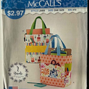 May include: A McCall's sewing pattern for tote bags. The pattern features two colorful tote bag designs with various patterns and pocket details. The text on the pattern reads "IT'S Sew SIMPLE" and "made with love in the U.S.A."