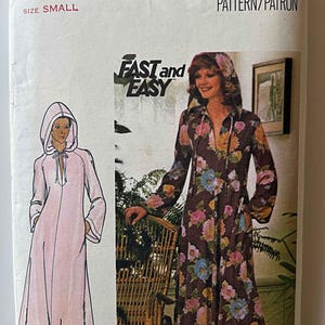 May include: Vintage Butterick sewing pattern for a hooded robe. The pattern features a drawing of a pink robe and a brown floral robe. The text "FAST and EASY" is also visible.