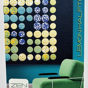 May include: A quilt design featuring a grid of colorful circles in yellow, blue, and green patterns against a dark background. The text "LEMON HALFTONE" is displayed vertically. The image also includes a green armchair and the text "ZEN CHIC".