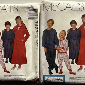 May include: Two vintage McCall's sewing pattern envelopes. Each shows a group of children modeling sleepwear. The patterns include pajamas, robes, and a long coat. The text "Lanz of Salzburg" is visible.