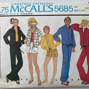 May include: Vintage McCall's 5685 sewing pattern. The pattern features illustrations of tracksuits and jackets in various colors, including black, yellow, blue, and red. The text on the pattern reads "HIS AND HER'S UNLINED JACKET AND PANTS OR SHORTS".