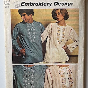 May include: Vintage Simplicity sewing pattern featuring embroidery designs for shirts. The cover shows two people wearing long-sleeved shirts with embroidered details. The shirts are in blue and cream colors. The pattern is for sizes 34-36.