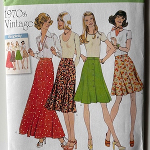 May include: Simplicity sewing pattern featuring vintage 1970s fashion. The pattern includes illustrations of women wearing skirts and tops. The pattern number is 8019, and the size range is U.S. 6-14.