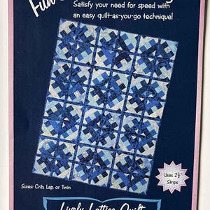 May include: A quilting pattern booklet titled Fun & Done! Quilting featuring the Lively Lattice Quilt design. The cover displays a blue and white geometric quilt, text indicating it uses 2 1/2 inch strips, and lists sizes as Crib, Lap, or Twin.