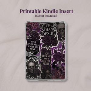 May include: A clear Kindle case insert featuring a gothic design with skulls, roses, and phrases like "Deeper Than Desire" and "Your Darkness Calls to Mine." The insert has a dark purple and black color scheme, with a variety of decorative elements.