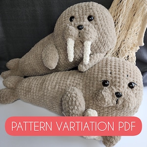 May include: Two crocheted plush walruses, one larger than the other, are lying on a white surface. Both walruses are brown and have white tusks. The larger walrus has its head resting on the smaller walrus's back. The text "PATTERN VARIATION PDF" is printed in red on a white background at the bottom of the image.