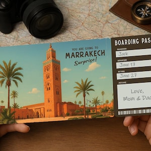 May include: A boarding pass with a picture of a mosque in Marrakech, Morocco. The text on the boarding pass reads "You are going to Marrakech Surprise!" and "Boarding Pass". The passenger name is Jack, the departure date is June 17, and the return date is June 27. The message reads "Love, Mom & Dad".