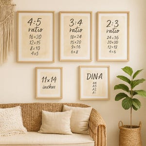 May include: A collection of framed art prints with various aspect ratios, including 4:5, 3:4, and 2:3, and sizes like 16x20 inches and 11x14 inches. The prints feature text and are displayed above a wicker sofa.