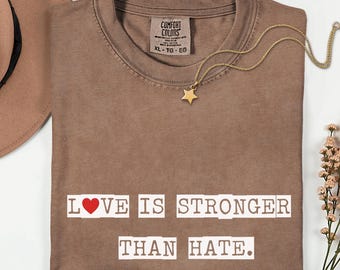 愛は憎しみよりも強いTシャツ｜反憎悪、社会正義Tシャツ、優しさの引用Tシャツ