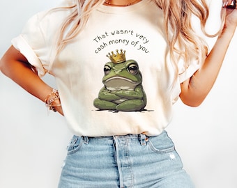それはあまり現金っぽい行動じゃなかったよTシャツ | グランピーフロッグ グラフィックTシャツ