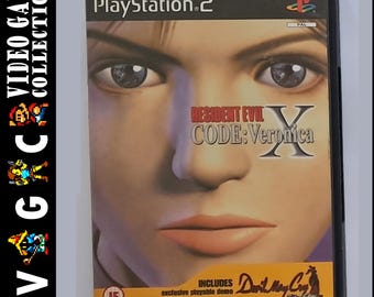 Ps2 Spiel Resident Evil Code Veronica komplettes Handbuch in Schutzhülle mit gratis Stickern und gratis Schlüsselanhänger