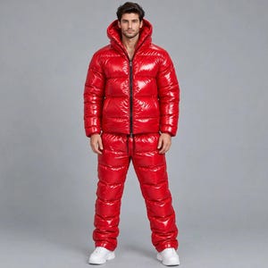 May include: A bright red, high-gloss puffer jacket with a hood and matching quilted puffer trousers. The jacket features a full-length black front zip, while the trousers have an elasticated drawstring waist. Both pieces have a shiny, reflective finish.