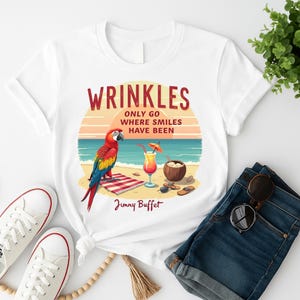 Wrinkles Only Go Where Smiles Have Been T-Shirt  Jimmy Buffett Quote  Beach Parrot Design  Coastal Inspirational Tee  Jimmy Buffett T-Shirt