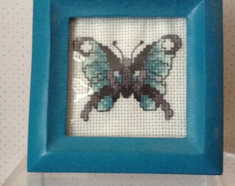 Turquoise and Black Butterfly Cross Stitch in Square Frame