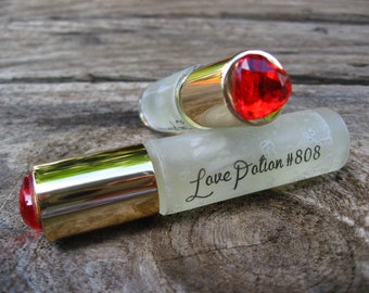 LOVE POTION #808. Notes of Pua Male and White Lily in a powdery base of Sandalwood and Vanilla. Made on Maui. 5ml or 10 ml Roll on Perfume.