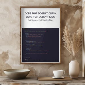 May include: A framed print with the text "CODE THAT DOESN'T CRASH, LOVE THAT DOESN'T FADE. No bugs. Just butterflies." and lines of computer code. The print is displayed in a wooden frame.