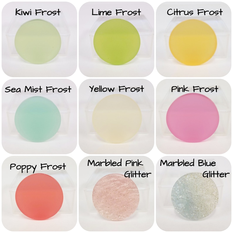May include: Nine round, frosted glass pieces in various colors, including green, yellow, pink, and blue. Each piece is labeled with a color name, such as "Kiwi Frost" and "Pink Frost". Two pieces have glitter.