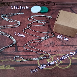May include: An image showcasing jewelry components. It includes two silver chains, two felt inserts (white and green), and a small brown gift box. The text "Free With Every Locket Purchase" is also visible.