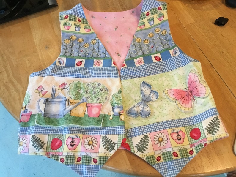 Novelty Fabric Vest Garden Lover Vest Scenes from a Garden Butterflies Strawberries Daisies Watering Cans Potted Plants Lady Bugs Sunflowers image 1