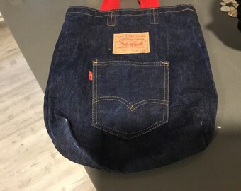 Levi's Strauss Tote Bag Denim Tote with Red Handles Traditional Badge on Front of Bag Red Levi's tag Large Original Style Pocket