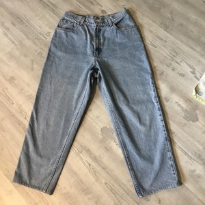 Levi Jeans 550 Levi’s Jeans Size 14 Regular Relaxed Fit Tapered Leg Red Levi tag on back Pocket Original Badge on Back