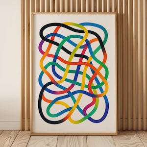 May include: Abstract art print featuring a colorful, interwoven design of curved lines in a variety of colors, including black, orange, green, and blue. The artwork is framed in a light wood frame and displayed against a wooden wall.