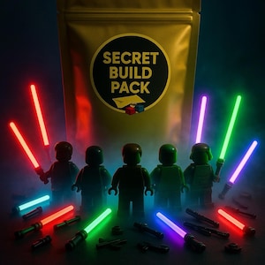 May include: A gold foil package labeled "SECRET BUILD PACK" with Lego minifigures holding glowing lightsabers in red, green, blue, and purple. The minifigures are arranged in a row, with additional lightsabers scattered below.